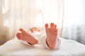 Feet of newborn baby. Baby little feet in parents hand. Feet skin care closeup. Happy family conception. Royalty Free Stock Photo