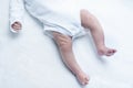 Feet of newborn baby boy or girl on changing table Royalty Free Stock Photo