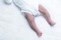 Feet of newborn baby boy or girl on changing table Royalty Free Stock Photo