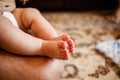 Feet Of A Newborn Baby In The Hands Of Parents. Happy Family Oncept. Royalty Free Stock Photo