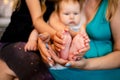 Feet Of A Newborn Baby In The Hands Of Parents. Happy Family Oncept. Royalty Free Stock Photo