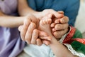 Feet of a newborn baby in the hands of parents. Happy Family oncept. Mum and Dad hug their baby`s legs Royalty Free Stock Photo