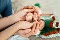 Feet of a newborn baby in the hands of parents. Happy Family oncept. Mum and Dad hug their baby`s legs Royalty Free Stock Photo