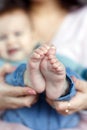 Feet of newborn baby on mother`s palm Royalty Free Stock Photo