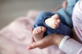 Feet of newborn baby on mother`s palm Royalty Free Stock Photo