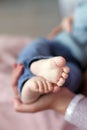 Feet of newborn baby on mother`s palm Royalty Free Stock Photo