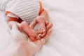 feet of newborn baby in mother& x27;s hand Royalty Free Stock Photo