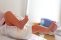 Feet of Newborn baby child seconds and minutes after birth lying on towel Royalty Free Stock Photo