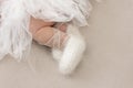 Feet of a newborn girl, little ballerina in fluffy points, dancer tired, tutu skirt, newborn Royalty Free Stock Photo