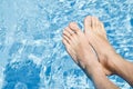 Feet Over the Swimming Pool Royalty Free Stock Photo