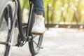 Feet On Pedals Of Unrecognizable Black Man Riding Bicycle In Park Royalty Free Stock Photo