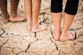 Feet people on cracked dry ground