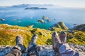 Feet of people hikers relaxing on top of the mountain, travel and hiking