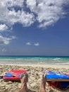 Feet on person sunbathing on beach Royalty Free Stock Photo