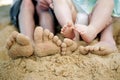 Feet playing with sand on the beach. Conceptual image shot Royalty Free Stock Photo