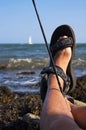 Feet Propped on the Rock Fishing Royalty Free Stock Photo