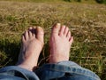 Feet relaxing in the grass medium shot Royalty Free Stock Photo