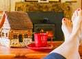 Feet Resting by the Fire With a Cup of Tea Royalty Free Stock Photo