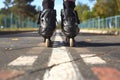 feet in rollerblades at a park paths start line Royalty Free Stock Photo