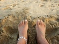 Feet in the sand on the beach Royalty Free Stock Photo