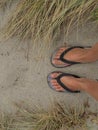 Feet in the sand at the beach in New Zealand Royalty Free Stock Photo