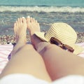 Feet on sandy beach