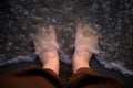 Feet on the sea sand Royalty Free Stock Photo