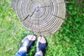 Feet selfie with old tree stump on the green grass background Royalty Free Stock Photo