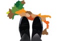 Feet with shiny shoes above Italy-