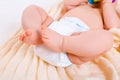 Feet of a six months old baby wearing diapers Royalty Free Stock Photo