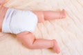 Feet of a six months old baby wearing diapers Royalty Free Stock Photo