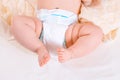 Feet of a six months old baby wearing diapers Royalty Free Stock Photo