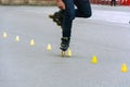 Feet of a skater while performing the slalom Royalty Free Stock Photo