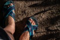 Feet in slippers on concrete Royalty Free Stock Photo