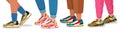 Feet in sneakers. Female and male walking legs in sport shoes with socks, pants and jeans. Trendy fashion fitness Royalty Free Stock Photo