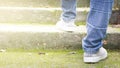 Feet Sneakers And Jeans Walking On Staircase Outdoor With Autumn Season Nature On Background Lifestyle Fashion Trendy Style, Walki Royalty Free Stock Photo