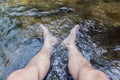 Feet soaking in the water
