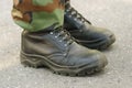 Feet of soldier in military boots anduniform Royalty Free Stock Photo