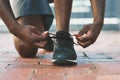 Feet, sport and shoes tie on pavement with person and athlete for running and jog. Shoelace, wellness, fitness with Royalty Free Stock Photo