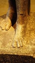 Feet of standing striding figure of the god Horus