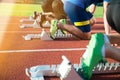 Feet on starting block ready for a spring start. Royalty Free Stock Photo