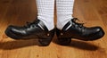 Feet in step shoes and white socks Royalty Free Stock Photo