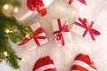 Feet with striped socks with Christmas gift boxes