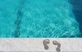 Feet by the swimming pool Royalty Free Stock Photo