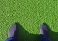 Feet on artificial grass Royalty Free Stock Photo