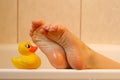 Feet taking with bath duck