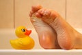 Feet taking with bath duck