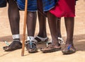 Feet three men of the Masai Mara tribe & x28;indigenous tribe of Kenya& x29;. Recycled rubber tires become Masai`s sandals Royalty Free Stock Photo