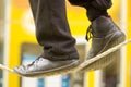 The feet of a tightrope walker