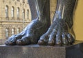 Feet of granite atlantes in the hermitage of St. Petersburg in R